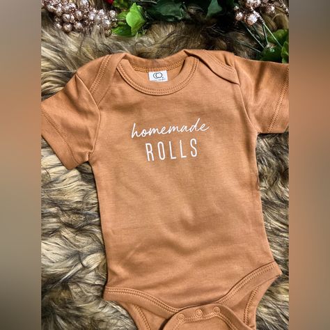 Introducing Our Adorable "Homemade Rolls" Infant Onesie! This Onesie Is Perfect For Your Little One Who Loves To Snuggle Up And Enjoy Some Freshly Baked Rolls. Made From High-Quality, Soft And Breathable Fabric, This Rust Colored Onesie Will Keep Your Baby Comfortable And Cozy All Day Long. The White "Homemade Rolls" Text Adds A Touch Of Humor And Cuteness To The Design, Making It A Great Conversation Starter For Family And Friends. The Onesie Features A Classic Snap Closure At The Bottom For Ea Homemade Rolls Onesie, One Piece Outfit Jumpsuit, Boys Smock, Homemade Rolls, Baked Rolls, Unisex Onesies, Baby Bundles, Pregnancy Gifts, Carters Baby