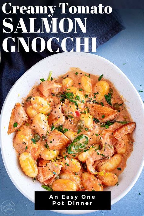 This Creamy Tomato Salmon Gnocchi is a quick and delicious dish perfect for a chilly evening. Succulent Salmon, in a creamy tomato based sauce with garlic, Italian seasoning, spinach, and pillowly soft gnocchi! This is the best kind of comfort food. Plus, everything is cooked together in the same pan, meaning this Creamy Tomato Salmon Gnocchi is so easy to make and quick to clean up. Fish Gnocchi Recipes, Tuna Gnocchi Recipes, Gnocchi And Salmon Recipes, Salmon With Gnocchi, Gnocchi Salmon Recipes, Gnocchi And Fish Recipes, Gnocchi And Salmon, Salmon And Gnocchi, Gnocchi With Salmon