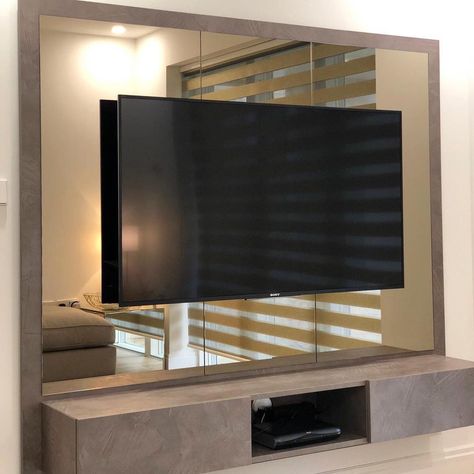 Beautiful TV unit made in luxe mink and surrounded by bronze mirrors 😍✨ #customfurniture #furnituredesigner Mirror Wall Decor Tv Unit, Tv On Mirror Wall, Tv Unit Mirror Design, Mirror Wall With Tv, Tv Mirror Wall, Tv Wall With Mirror, Tv Unit With Mirror Panelling, Mirror Behind Tv, Mirror Next To Tv