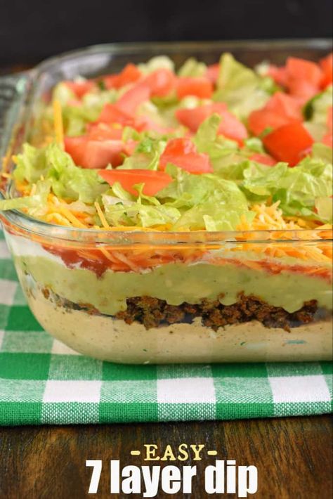 The Ultimate 7 Layer Dip recipe is packed with layers of Cream Cheese, Sour Cream, Ground Beef (and/or Beans), Guacamole, Salsa, Cheese, and more! #tacodip #superbowl #7layerdip Cheese Dip Recipes Easy, Layer Dip Recipe, 7 Layer Dip Recipe, Mexican Layer Dip, Cream Cheese Recipes Dip, Layered Dip Recipes, 7 Layer Dip, Nacho Dip, Layered Taco Dip