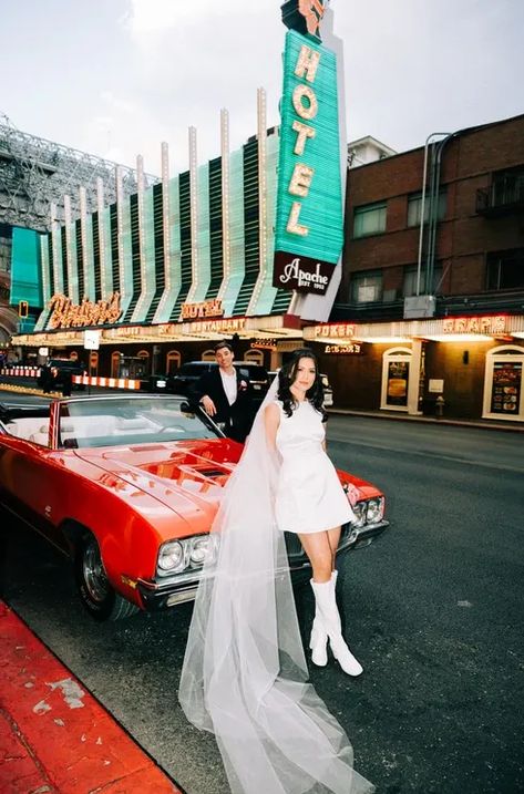 Timber & Austin eloped at the Little White Wedding Chapel in Las Vegas, captured by las vegas elopement photographers brazen honey films. Short wedding dress inspo, kitsch elopement vibes, neon lights, vintage wedding car, convertible classic car for wedding photos. Best vegas elopement inspiration! Classy Las Vegas Wedding, Downtown Vegas Wedding Photos, 70s Vegas Wedding, Vintage Vegas Wedding Dress, Classy Vegas Elopement, Vintage Las Vegas Wedding, Vintage Vegas Elopement, Vintage Elopement Aesthetic, Old Vegas Wedding