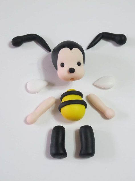 How to make a gum paste bumble bee cake topper • CakeJournal.com Bumble Bee Cake Topper, Clay Bees, Bee Cake Topper, Bumble Bee Cake, Bee Cake, Foam Clay, Bee Cakes, Fondant Animals, Baby Shower Diaper Cake