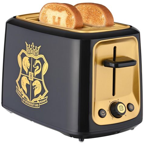 The Warner Brothers Harry Potter 2-Slice Toaster unlocks a magical experience by imprinting a Hogwarts crest or Harry's glasses right onto your toast. This toaster lets any kitchen wizard show off their Hogwarts pride and create an epic breakfast in just a few minutes. One slot of the toaster imprints toast with the Hogwarts crest while the other slot features Harry's glasses. This magical touch is sure to make mealtimes more enjoyable for the biggest Harry Potter fans. It's the perfect way to combine food and fun together, making it a great addition to any kitchen. Harry Potter Kitchen, Harry Potter Snacks, Harry Potter Accessories, Harry Potter Glasses, Harry Potter Items, Harry Potter Food, Harry Potter Merchandise, Hogwarts Crest, Harry Potter Decor