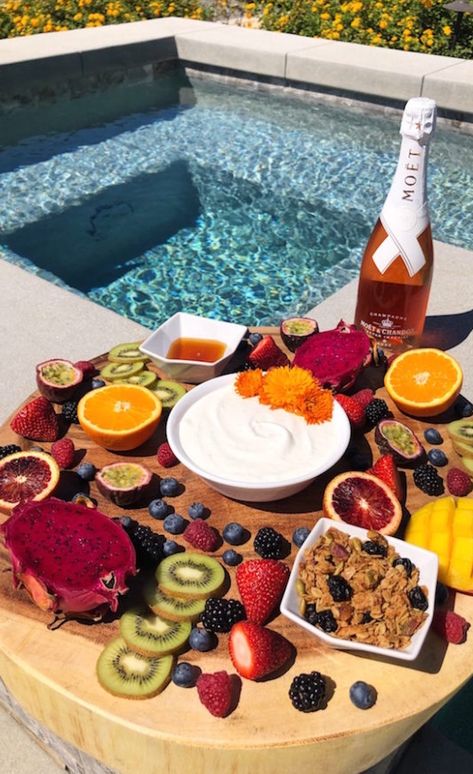 A large wooden board filled with sliced fruit, homemade vanilla yogurt, granola, and champagne sits next to a pool. Coachella Food, Poolside Brunch, Grad Brunch, Coachella Photos, Rosé Champagne, Wishlist Board, Brunch Board, Yogurt Granola, Best Brunch Recipes