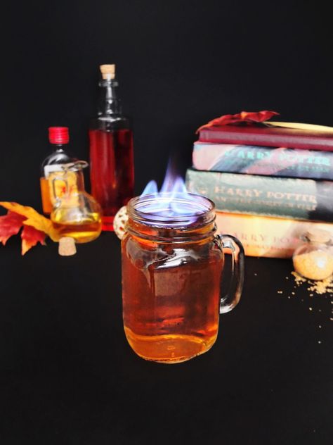 Harry Potter themed cocktail made from butterbeer and firewhisky. Perfect for Harry Potter themed parties. Also a great flaming Halloween cocktail or fall cocktail. Fire cocktails. // www.ElleTalk.com #WhikseyCocktail #ElleTalk #CocktailRecipe #DrinkRecipe Fire Cocktails, Coconut Rum Recipes, Dark Rum Cocktails, Spiced Rum Cocktails, Harry Potter Cocktails, Hot Buttered Rum Recipe, Harry Potter Drinks, Fire Theme, Rum Punch Recipes