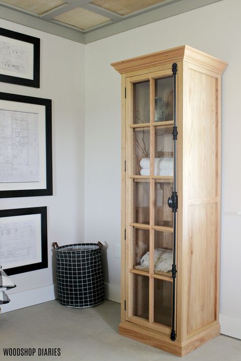 Can you believe this was a DIY project?  This amazing glass door linen cabinet made from red oak was actually a fairly simple build that didn't require a bunch of fancy tools.  Grab the plans to build your own and check out the gorgeous cremone bolt in this post.  If you've ever wanted to build your own glass door storage cabinet, this is the perfect time to try. Diy Small Cabinet With Doors, Diy Linen Cabinet, Diy Glass Cabinet, Diy Glass Cabinet Doors, Armoire Plans, Quilt Cabinet, Tall Narrow Storage Cabinet, Whiskey Cabinet, Door Plans