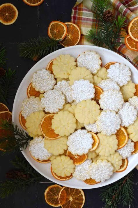 Slightly sweet and buttery with a burst of fresh citrus flavour, these Orange Spritz Cookies melt in your mouth! Every holiday cookie exchange or plate must have a spritz cookie, so I encourage you to try this classic recipe with an orange zest twist! Glazed Spritz Cookies, Maple Spritz Cookies, Orange Spritz Cookies, Flavored Spritz Cookies, Cookie Press Cookies Recipe, Citrus Cookies, Spritz Cookie, Spritz Cookie Recipe, Holiday Cookie Exchange