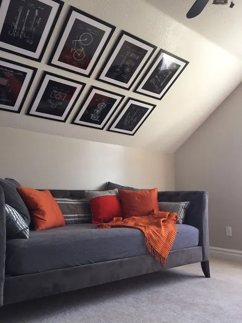 How to hang a gallery wall on a vaulted ceiling · The Glitzy Pear Vaulted Ceiling Decor, Vaulted Ceiling Bedroom, Tan Leather Sofas, Tan Sofa, Slanted Walls, Hanging Artwork, Creating Artwork, Divider Wall, How To Hang