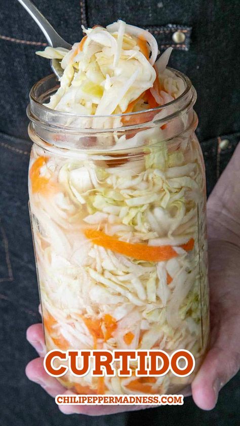 Holding a big jar of the curtido Curtido Recipe, Cabbage Salsa, Salvadoran Food, Chili Pepper Recipes, Homemade Hot Sauce, Chorizo Recipes, Shredded Cabbage, Spicy Chicken Recipes, Fermented Cabbage