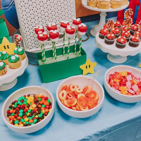 Super Mario Bros Party Desserts, Mario Birthday Party Sweets, Mario Party Cupcakes, Mario Party Candy Table, Mario Bros Dessert Table, Peaches And Mario Birthday, Super Mario Snack Ideas, Mario Brothers Party, Mario Kart Themed Food