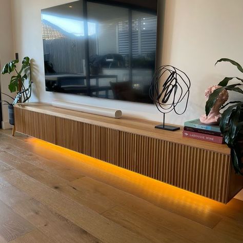 We all love to unwind and watch TV and a great way to make a feature of this area is with hidden lighting to create a floating unit. Here are some really nice examples of how it might be done using simple and cost-effective hidden led strip.

#tvunit #interiordesign #lightingdesign #hiddenlighting Wall Hung Entertainment Unit, Oak Floating Tv Unit, Slatted Tv Unit, Tv Bench Decor, Wall Hung Tv Unit, Tv Wall White, Entertainment Unit Ideas, Tv Unit With Shelves, Floating Entertainment Unit