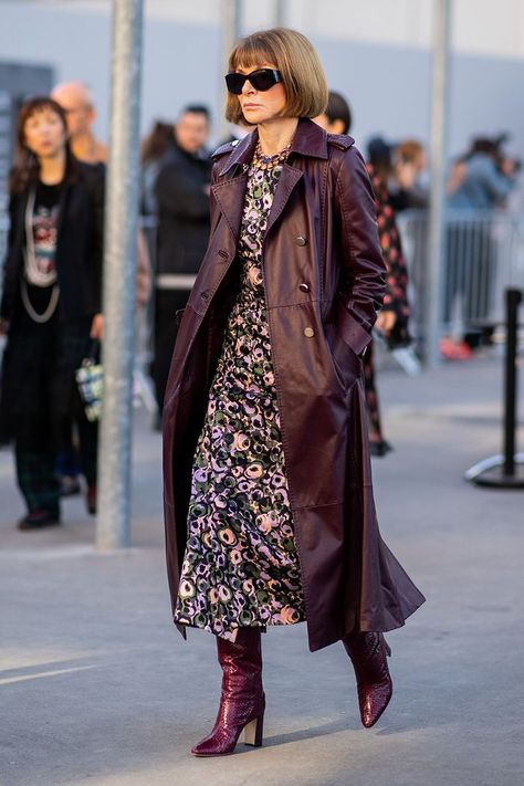 Power uniforms: Anna Wintour in a leather trench, floral dress and matching boots Anna Wintour Winter Outfits, Anna Wintour Style Dresses, Trench With Dress Outfit, Anna Wintour Dress, Floral Trench Coat, Winter Floral Outfit, Winter Floral Dress Outfit, Floral Dress And Boots, Shirt Dress And Boots Outfit