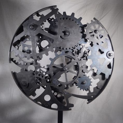 Steel cog sculpture by @jordanbrittsculpture #sculpture #metalwork #metalsculpture #cogs #steelsculpture #metalart #cogart #weldporn #weldingart #weldart #artcollective #artistoninstagram #craftagram #instacraft #craftwork #craftsman #crafty #craftart #metalcraft #unknown #embracetheunknown #theunknownemporium #tue Suspended Art, Cogs And Gears, Skeleton Clock, Light Shield, Industrial Steampunk, Mixed Media Sculpture, Steampunk Gears, Steel Sculpture, Wall Sculpture Art