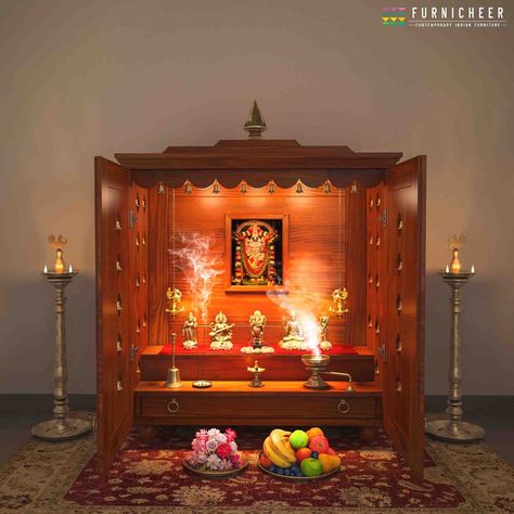 "SKU: TLCB3648 Dimension : L 36\" x D 15\" x H 48.5\" Mandir Weight: 48 kg Handcrafted solid wood free standing pooja mandir with cherry brown finish, antique decorative brass bells, and antique brass handle on shutter which enhances your prayer space. Mandir includes: - 2 step and 1 drawer at the bottom, with turned legs and gopuram design Kalash - 2 Shutters and a back - Antique brass bells - 2 Antique brass handle on the drawer - 2 Antique brass handle on the shutter - 2 hanging brass lamps A Rent Room, Mandir Ideas, Wooden Temple, Brass Lamps, Mandir Design, Temple Design For Home, Wood Kiln, Pooja Mandir, Cherry Brown