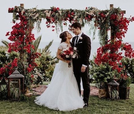 Bold and bright red and pink wedding flowers - wedding ceremony arch - structure - chuppah - outdoor wedding - seaside - bride and groom - bridal style - grooms style - bridal bouquet - ceremony style Wisteria Wedding Colors, Arch Structure, Wedding January, Wedding Seaside, Wedding Flowers Pink, Wisteria Wedding, Entrance Arch, Coral Wedding Flowers, Wedding Chuppah