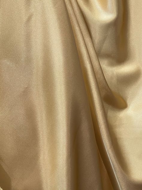 THIS IS luxurious mulberry luxurious silky stretch  charmeuse fabrics  COLOR: Gold  WIDTH : 57 inch  Made : made in Italy Comp: 90% poly/5% silk5% spandex  LENGHTE ; SOLD EVERY YARD MULTIPLE YARDS ARE ONE CONTINUOUS CUT  CARE : DRY CLEAN ONLY  NEED MORE THAN 20 YRDS AND UP PLEASE SEND US EMIL AND WE CAN ACCOMMODATE YOU SO YOU CAN COMPLETE YOUR PARTICULAR PROJECT  DISCLAIMER : WE HAVE MADE AN AFFORT TO PROVIDE FABRICS IMAGES THAT COLSELY REPRESENT THE FABRICS HOWEVER DUE TO ALL THE POSSIBLE VARIA Vintage Luxury Color Palette, Gold Color Swatch, Soft Gold Aesthetic, Shaadi Dresses, Golden Fabric, Gold Shades, Champagne Gold Color, Metallic Gold Color, Light Gold Color