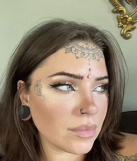 Womens Under Chin Tattoo, Dermal Piercing Forehead, Third Eye Dermal, Forehead Tattoo Woman Hairline, Forehead Dermal Piercing, Cheekbone Tattoo, Forehead Dermal, Cheek Dermal Piercing, Forehead Tattoo Woman