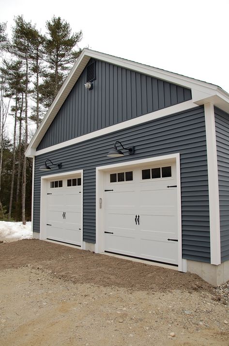 clapboard & board and batten vinyl siding - white trim with black goose-neck lights above garage doors Garage With Vinyl Siding, Exterior Gable Lighting, Board And Batten Garage Door, Above Garage Door Lighting, Board And Batten Garage Exterior, Lights Above Garage Doors, Garage Siding Ideas, Board And Batten Gable, Vinyl Board And Batten Siding