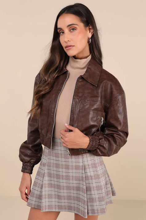 Hit the road looking cuter than ever in the Lulus Iconic Travels Brown Vegan Leather Cropped Bomber Jacket! Pebbled faux leather, with distressed fading throughout, shapes this stylish jacket with a collared neckline and long sleeves with drop shoulders and fitted elasticized cuffs. An exposed silver zipper secures at the front of the cropped bodice that boasts two, seamed zippered front pockets. Classic, elasticized banded hem completes the look. Pair with the matching skort for a complete look Brown Leather Moto Jacket, Dark Brown Leather Jacket, Short Black Skirt, Brown Crop Top, Cropped Leather Jacket, Vegan Leather Jacket, Silver Zipper, Hit The Road, Stylish Jackets