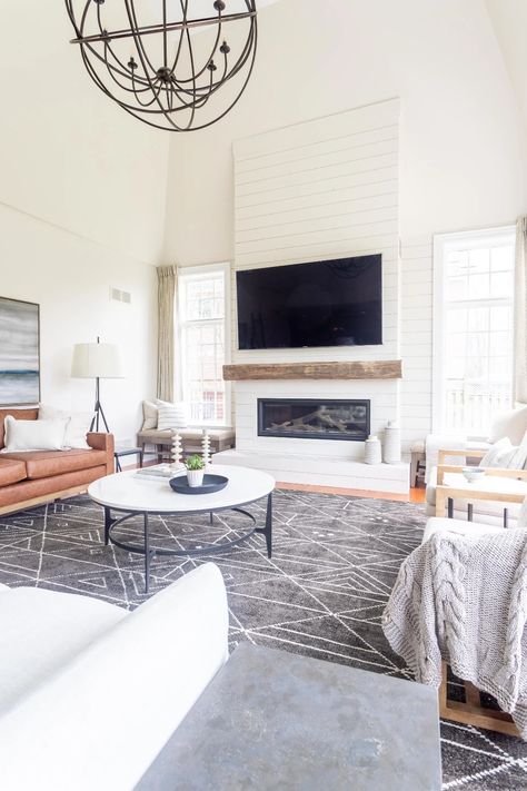 Harper Designs - vaulted ceilings with a tall white shiplap fireplace. We used a reclaimed beam as a mantel and some graphic tile around the hearth.   jaclynharperdesigns.com Mantel Styling, New House Living Room, Fireplace Tv Wall, Shiplap Fireplace, White Fireplace, White Shiplap, Fireplace Remodel, Diy Fireplace, Home Fireplace