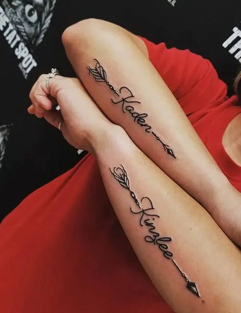 Arm Tattoos For Women Sons Name, Name Tattoo Feminine, Flower With 2 Name Tattoo, Name Tattoo Forearm Woman, Name Shoulder Tattoos For Women, Arrow With Name Tattoo Design, Couples Names Tattoos, Men’s Name Tattoos, Tatoos Woman Hand Name