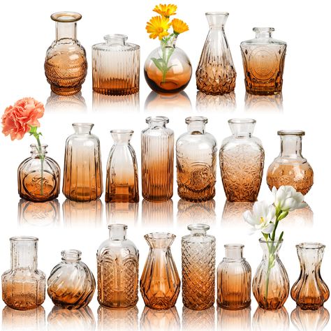 PRICES MAY VARY. Vintage Style: You will receive 20 amber glass bud vases. Each flower vase for centerpieces has different sizes and patterns, which can easily combine flowers or decorations according to your ideas Ingenious Manufacture: Our mini vases are made of sturdy, thick glass and are not easy to break. The mouth of the small vase is polished. The bottom is thickened for easier placement. And our vases for home decor are produced with high light transmittance, which makes them look very t Copper Centerpiece Wedding Vases, Deco Vase Ambre, Brown Bottle Vase Wedding, Small Vase Centerpiece Rustic, Vase With Wine Corks Centerpieces, Copper Bud Vase, Round Table Centerpieces Wedding Wine Bottles, Amber Bottles And Candles Wedding Centerpieces, Simple Fall Vases