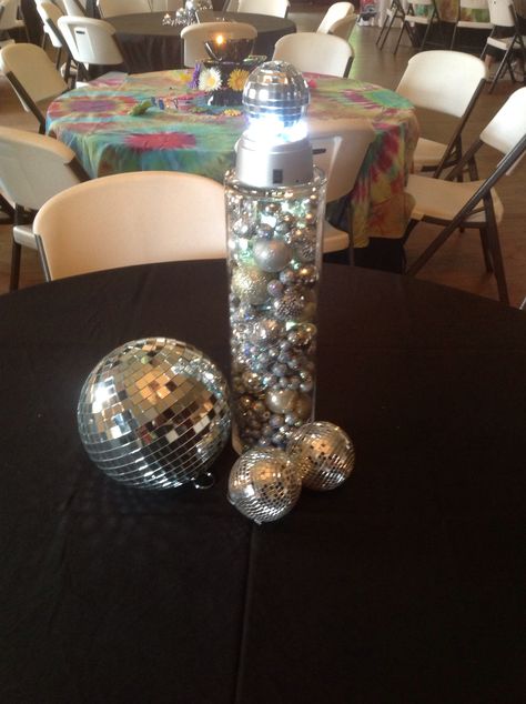 One of the 70's tables at Zach's party.  #70sparty #70scenterpiece Disco Party Decorations 70s, 1970s Party Theme, 70s Theme Party Decorations, 60s Party Themes, 70s Dinner Party, 70s Party Theme, 70s Theme Party, Decade Party, Search Pinterest