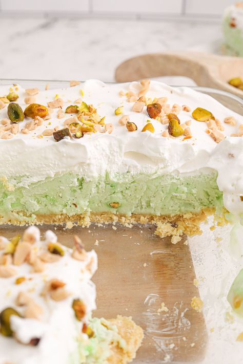 A simple and refreshing pistachio ice cream cake recipe made with instant pudding mix and a cookie crumb crust! It's the perfect layered frozen dessert for summer parties. Pistachio Ice Cream Dessert, Pistachio Ice Cream Cake, Pudding Cream Pie, Pistachio Pudding Pie, Pistachio Pie, Crumb Crust, Pistachio Dessert, Pistachio Recipes, Ice Cream Cake Recipe