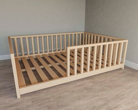 Montessori Floor Bed With Fence 🔆 #MontessoriBed #ChildFurniture #ToddlerRoomDecor #NaturalMaterials #WoodenToys #KidsRoomInspiration #MontessoriHome #EcoFriendlyKids #ToddlerSleep #ParentingIdeas Raised Floor Bed, Floor Bed Base, Toddler Floor Bed Plans, Montesorri Bedroom Toddler, Diy Floor Bed Frame, Diy Toddler Bed On Floor, Diy Montessori Bed, Diy Floor Bed, Floor Bed Toddler