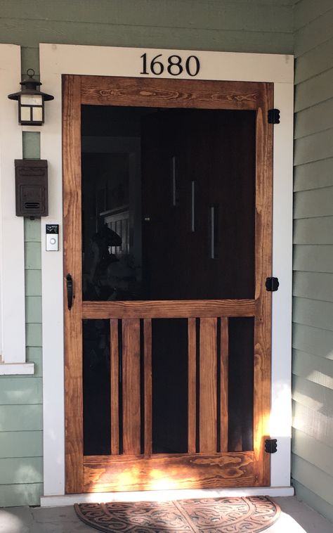 Screen doors are too expensive for our 42" front door... So I made this one. Total cost, including wood, screen and hardware was around $100. Craftsman Front Door With Screen Door, Rustic Cabin Screen Doors, Craftsman Style Screen Door, Wood Screen Door Farmhouse, Screen Door For Log Cabin, Cabin Exterior Ideas, Southern Front Porches, Painted Screen Doors, Ocean Cottage