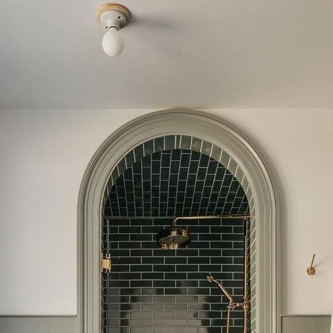 Alexander James Tile Studio on Instagram: "An arched opening creates a dream destination in this moody shower from @corey.lohmann.design. Matching the tone of the rich green tile to the millwork brings it full circle.⁣ ⁣ 𝗦𝗵𝗼𝗽 𝗢𝘂𝗿 𝗦𝗶𝗺𝗶𝗹𝗮𝗿 𝗦𝘁𝘆𝗹𝗲𝘀: Makoto Midori Green 2x10 Matte Ceramic 𝘭𝘪𝘯𝘬𝘦𝘥 𝘪𝘯 𝘣𝘪𝘰⁣ ⁣ ⁣⁣⁣⁣⁣⁣#AlexanderJames | Design: @corey.lohmann.design | Photography: @margaretrajic⁣ ⁣ #tile #ceramictile #tilestyle #lonnyliving #interiordesign #homerenovation #interior123 #bhilivebeautifully" Green Subway Tile, Porcelain Wall Tile, Stunning Bathrooms, Green Tile, Green Bathroom, Traditional Modern, Tile Work, Beautiful Bathrooms, Amazing Bathrooms