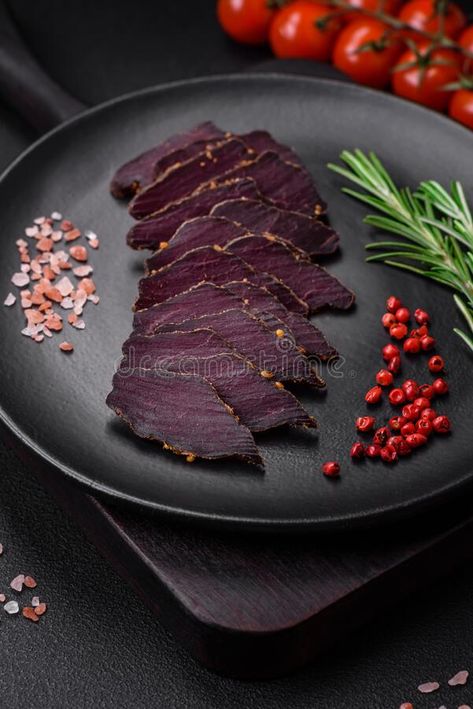 Delicious dried smoked beef or horse meat jerky with spices and salt royalty free stock photo Horse Meat, Venison Steak, Concrete Background, Smoked Beef, Spices And Herbs, Recipe Images, Jerky, Meat Jerky, Borders