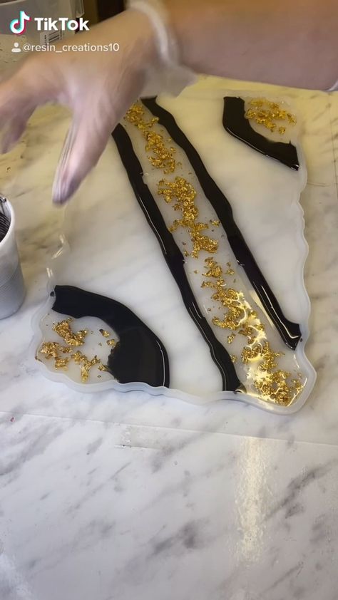 resin_creations1 on Instagram: 2 days work into 30 seconds 🤟 I’m loving this black and gold tray! Black And Gold Resin Tray, Black And White Resin Tray, Black Resin Tray, Gold Tray, Black And Gold Marble, Resin Tray, January 20, Gold Flakes, Gold Marble