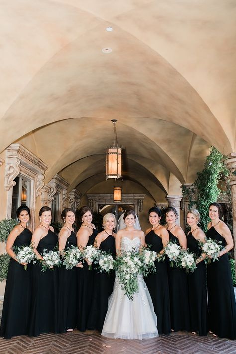 Bridesmaids wearing black long dresses with the bride in the middle and everyone holding posy shaped bouquets with white roses and lots of greenery | Ashley Rae Photography | villasiena.cc Black Bridesmaid Dresses With Greenery, Black Bridesmaid Dresses With White Flowers, Black Braidsmaids Dresses, Black Greenery And White Wedding, Black White And Greenery Wedding, Wedding Bouquets White, Bridesmaid Dresses Black, Black Bridesmaids Dresses, Rose Bridesmaid Bouquet