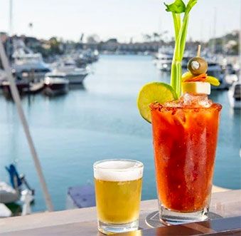 10 Spectacular Spots to Dine with a View in Newport Beach Newport Beach Restaurants, Wine Poached Pears, Crystal Cove State Park, Ahi Poke, Marina Village, Beach Cocktails, Grilled Octopus, Beach Drinks, Electric Boat