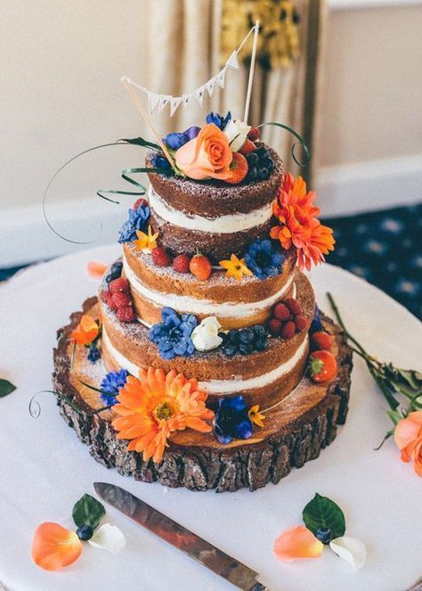 Blue and Orange August Wedding Colors for 2022, Blue Bridesmaid Dresses - ColorsBridesmaid Natural Cakes, August Wedding Colors, Orange Wedding Cake, Prairie Wedding, Orange Wedding Colors, Colorful Wedding Cakes, Boho Wedding Cake, Wedding Orange, Wooden Cake Stands