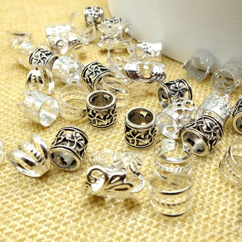 PRICES MAY VARY. 【Package Includes】:100PCS Silver Hair Jewelry for Braids, sufficient quantity can satisfy your daily decorative needs for different occasions. 【Easy to Use】:Braid or chunk your hair in desired style, twist ends open on sides of hair ring, they can easily be done with your fingers (no pliers necessary), insert rings at desired location on your braid, finally close the opening of the ring. 【Wide Usage】:These hair jewelry are very suitable for party,daily life,work,school,holiday,f Silver Hair Jewelry, Jewelry For Hair, Jewelry For Braids, Hair Jewelry For Braids, Braid Cuffs, Hello Kitty Y2k, Braid Accessories, Hair Cuffs, Dreadlock Beads