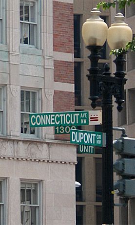 Street sign for Dupont Circle and Connecticut Avenue NW, location of the building, with some of the Art Deco details in the background Circle Building, Washington Dc Landmarks, Rachel Miller, Dupont Circle, Carlton Hotel, Washington University, George Washington University, Street Sign, Street Signs