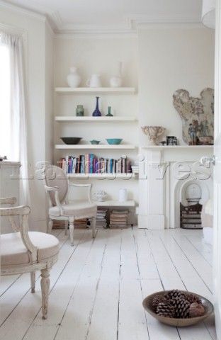 Contemporary shelving in room with bare painted floorboards  London townhouse  England  UK White Painted Floors, White Floorboards, Painted Floorboards, White Wooden Floor, Floating Shelves Bedroom, Painted Wood Floors, White Wood Floors, Floating Shelves Living Room, Floating Shelves Kitchen