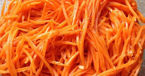 Russian "Korean carrot" salad is a marinated salad with fresh carrot as the main ingredient. The dressing is a simple vinaigrette spiked w... Korean Carrot Salad, Korean Carrot, Marinated Salad, Michigan Food, Simple Vinaigrette, Carrot Salad, Shredded Carrot, Russian Recipes, Pickling Recipes