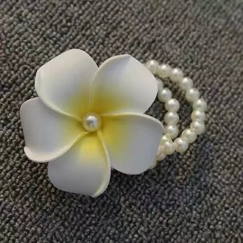 white frangipani with pearl bracelet/ Frangipani bracelets necessary accessories sand beach resort pearl White Frangipani, Flower Headband, Beach Resort, Beach Sand, Flower Crafts, Boutonniere, Art Craft, Flowers In Hair, Pearl Bracelet