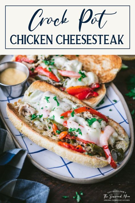 The classic Philly chicken cheesesteak becomes an easy weeknight dinner -- thanks to the convenience of a slow cooker! With garlic, peppers, onions, Italian seasoning, and melted provolone cheese, this simple Crock Pot chicken cheesesteak recipe is full of satisfying flavor. Serve the tender, juicy shredded chicken on toasted hoagie rolls, and pair the sandwiches with a simple green salad, French fries, or crunchy potato chips. Philly Chicken Cheesesteak, Simple Crock Pot Chicken, Chicken Cheesesteak Recipe, Easy Chicken Dinner Ideas, Juicy Shredded Chicken, Chicken Philly Cheesesteak, Philly Sandwich, Chicken Cheesesteak, Chicken And Stuffing