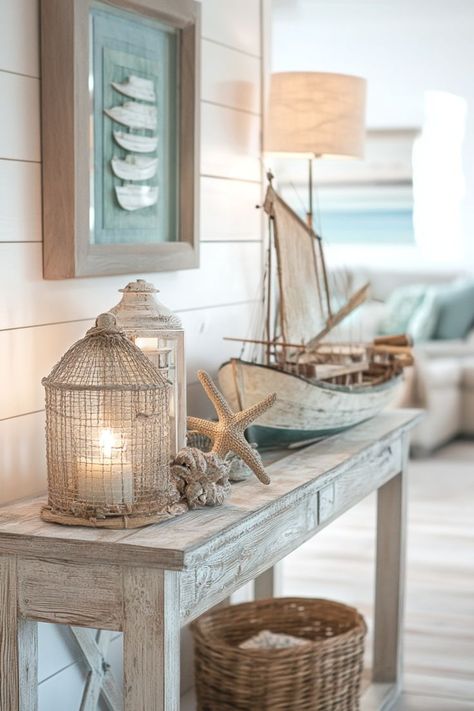 Incorporate whitewashed wood furniture to enhance your beach-inspired decor. Pair it with soft lighting fixtures like white paper lanterns or frosted glass lamps to create an airy and serene atmosphere. Hamptons House Interior, Coastal Living Room Decor, Coastal Living Room Ideas, Florida Decorating, Coastal Ideas, White Paper Lanterns, Cottage Dining Rooms, Beach Inspired Decor, Home Refresh