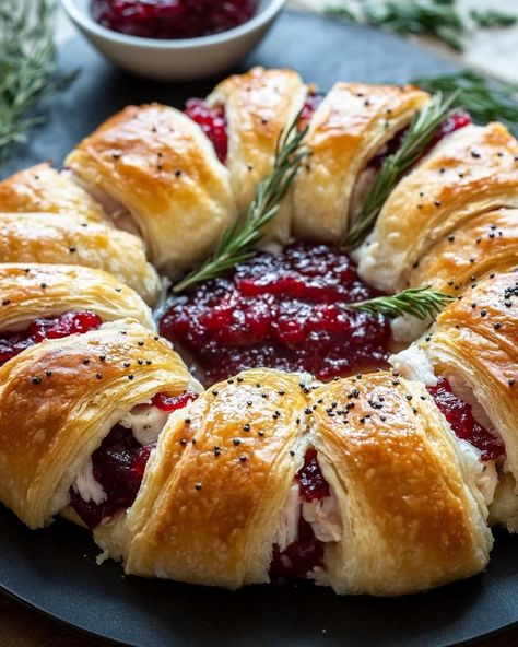 ￼ Savory Turkey and Cranberry Crescent Ring Ingredients: 1 tube crescent rolls 4 oz chive and onion cream cheese, softened 1 1/2 tbsp Dijon mustard 3 tsp finely chopped fresh rosemary or thyme, divided 2 cups shredded Gruyere cheese, divided 1 lb thinly sliced turkey (leftover or deli turkey) 1 (14 oz) can whole berry cranberry sauce 2 tbsp butter, melted 1/2 tsp poppy seeds 1/2 tsp granulated garlic 1/4 tsp salt (adjust to taste) Instructions: Preheat Oven and Prepare Pan: Preheat the oven to 375°F (190°C). Line a large baking sheet with parchment paper or a silicone baking mat. Prepare Crescent Rolls: Separate the crescent rolls and arrange them on the parchment paper in a circle with the widest portion on the inside and the edges overlapping. Prepare Filling: In a small bowl, whisk toge Chive And Onion Cream Cheese, Whole Berry Cranberry Sauce, Turkey And Cranberry, Cranberry Turkey, Granulated Garlic, Crescent Recipes, Thanksgiving Leftover Recipes, Crescent Ring, Easy Lunch Ideas