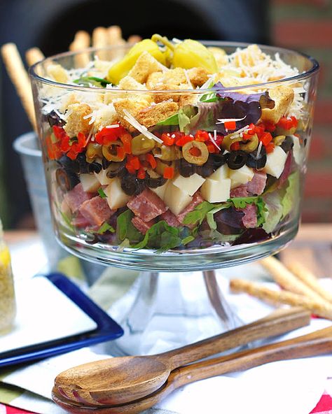 Layered Muffuletta Salad - southern discourse Muffaletta Salad Recipe, Muffaletta Salad, Muffuletta Salad, Muffaletta Recipe, Salad With Homemade Dressing, Muffaletta Sandwich, Packaged Salad, Layered Salad Recipes, Spring Mix Salad