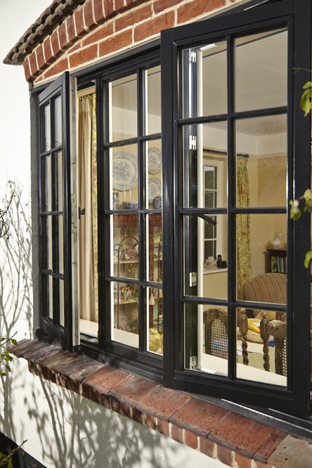 Black timber window featuring traditional cottage bars Box Window Curtains Ideas, Paneled Windows, Rustic Windows, Windows Farmhouse, Wooden Casement Windows, Aluminum Windows Design, Circular Windows, Windowsill Decor, Windows Modern