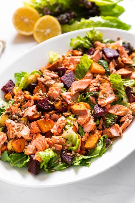 Full of beets, sweet potato, carrots, and parsnips, this salmon salad is a winter root vegetable dream! Topped with sunflower seeds and a homemade vinaigrette, it's your new go-to salad! | wyseguide.com #salad #salmon #beets Salmon And Beet Salad, Winter Salmon Salad, Salmon And Beets, Beets Sweet Potato, Salmon Lentils, Root Vegetable Salad, Carrots And Parsnips, Salad Salmon, Salmon Vegetables