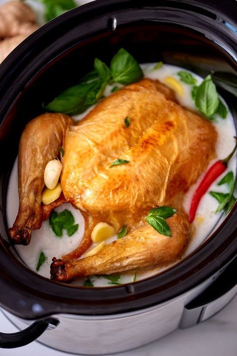 If you have enjoyed the wonder that is chicken cooked in milk, wait until you try chicken cooked in coconut milk! This recipe shows you how to recreate Jaime Oliver's chicken in milk with coconut milk and in the slow cooker. This tweaked recipe calls for a whole chicken, kosher salt, coconut milk, low-sodium chicken broth, garlic, fresh basil leaves, fresh Thai red chile and freshly squeezed lime juice. Chicken In Coconut Milk, Crockpot Thai, Cook A Whole Chicken, Cooking With Coconut Milk, Milk Chicken, Coconut Milk Chicken, Best Crockpot Recipes, Slow Cooked Meals, Basil Chicken