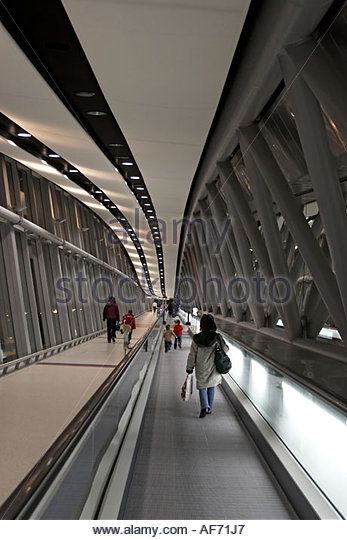 People woman and children on bridge moving walkway travellator at Gatwick airport England - Stock Image Modern Factory Design, Moving Walkway, Modern Factory, Gatwick Airport, Gatwick, Factory Design, Walkway, Stock Photography, Hallway