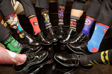 Groomsmen in dress shoes and slacks with superhero theme socks hulk spiderman superman batman more Groomsmen Marvel Socks, Superhero Theme Wedding, Avengers Wedding Theme, Marvel Wedding Decorations, Super Hero Wedding Theme, Avengers Themed Wedding, Wedding Marvel Theme, Groomsmen Socks Ideas, Spiderman Wedding Theme